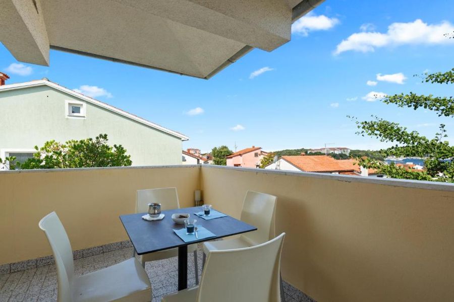 The covered balcony of the two-bedroom apartment