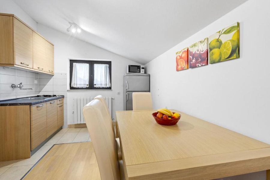 Kitchen with a bowl of fruit on the table